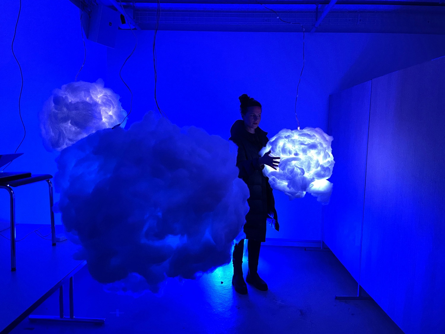 CLOUD. — glowing clouds hanging in the installation room