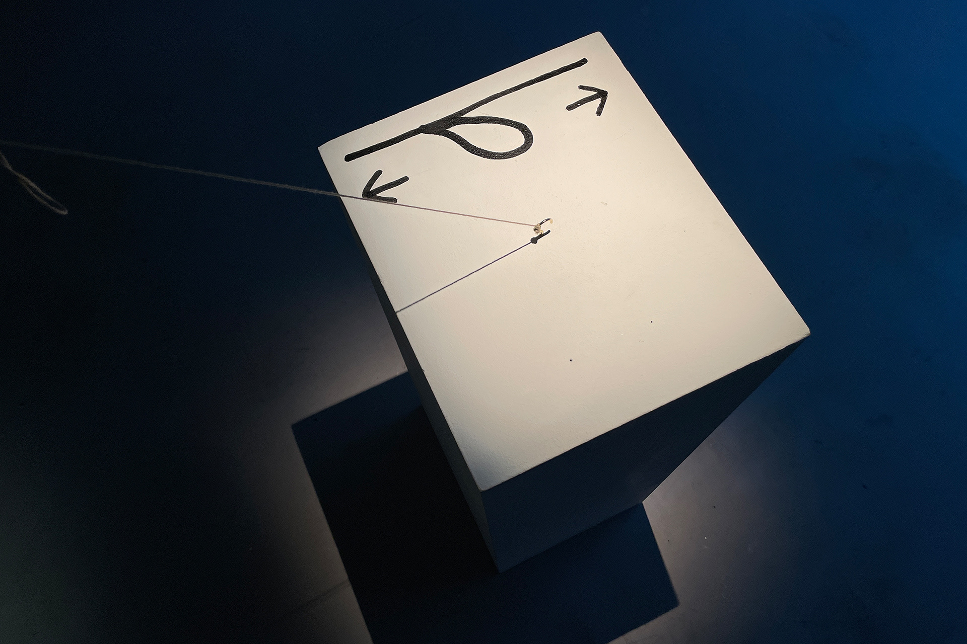 Echoes in Space — plinth detail showing the suspension string and movement diagram