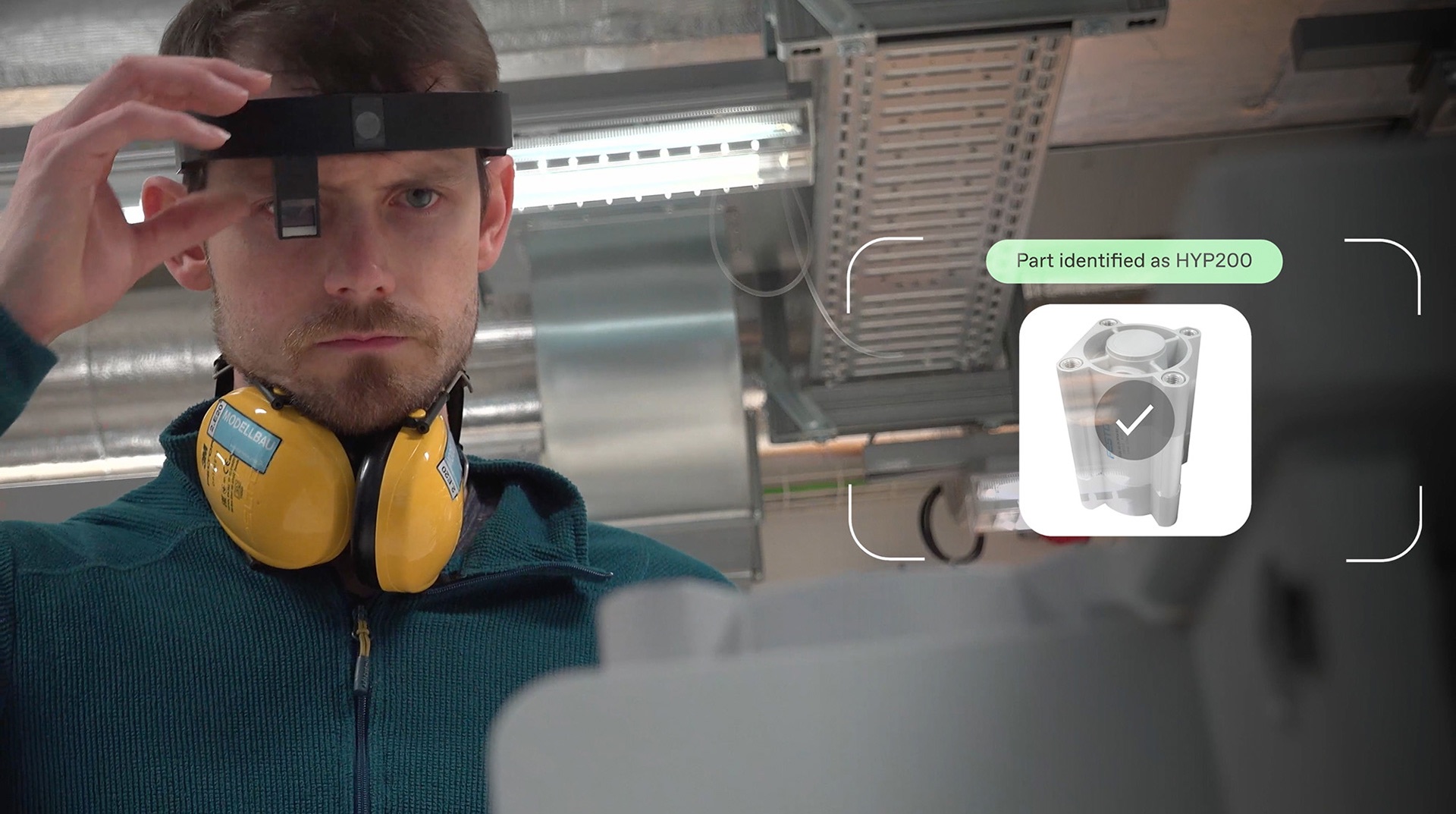 IndustryVision — worker using the Almer Arc glasses with AR overlay